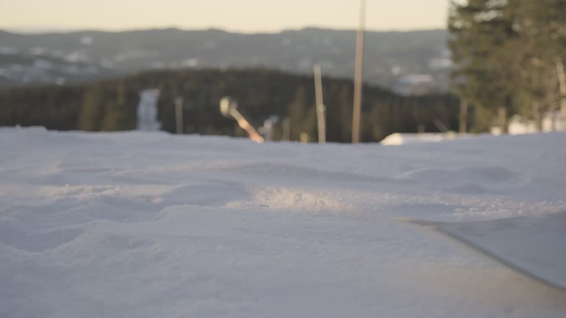 Bataleon Fase snowboard bindings, snowboarder entering the binding before riding away